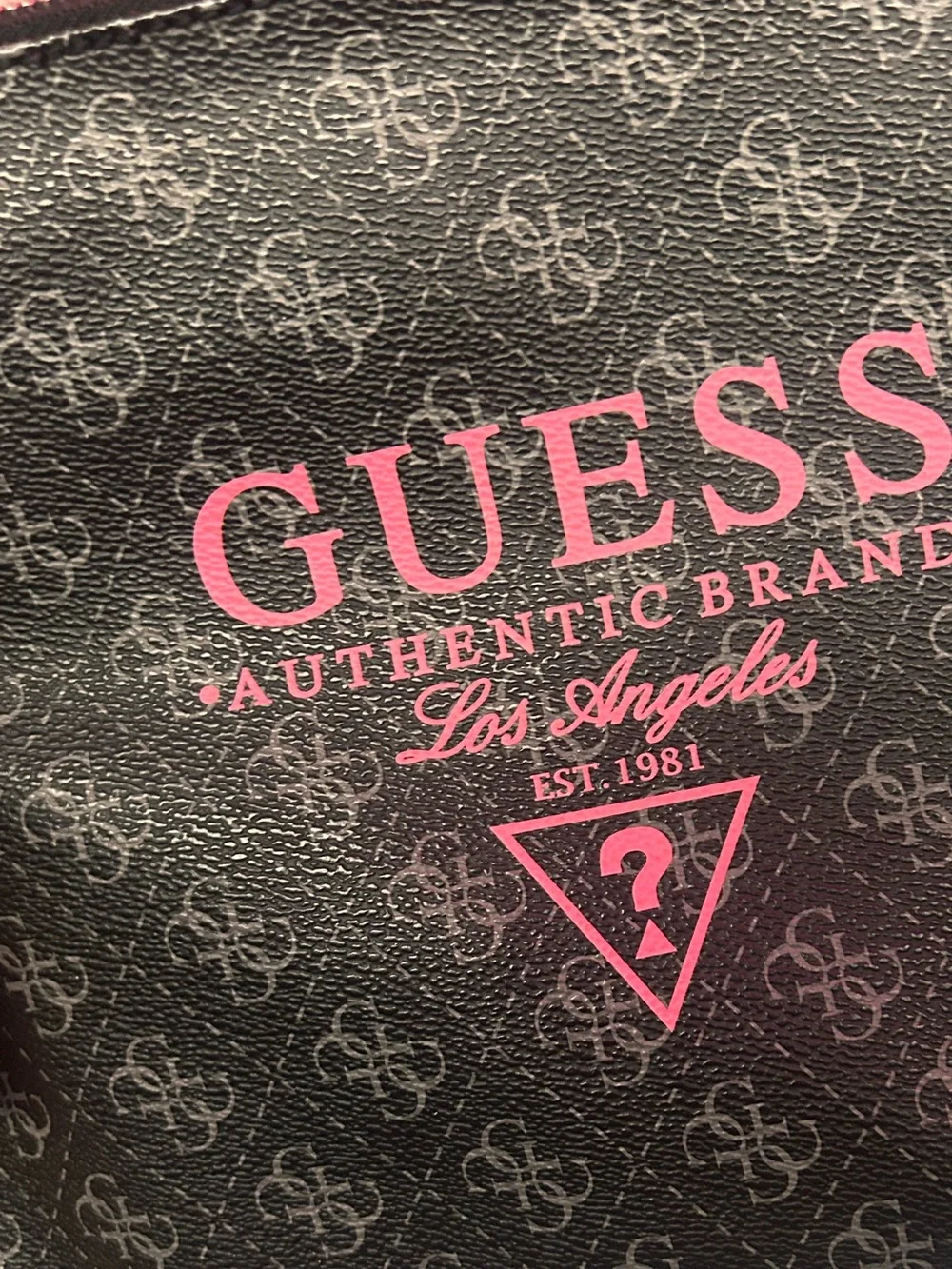 GUESS Black Logo Pouch with Pink Accent and studded clutch handle